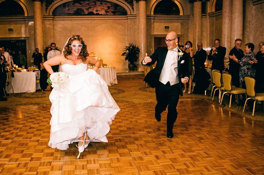 bride and groom dancing with funny glasses