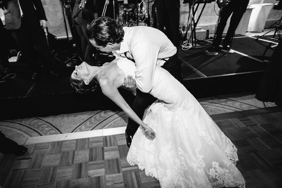 groom dipping bride