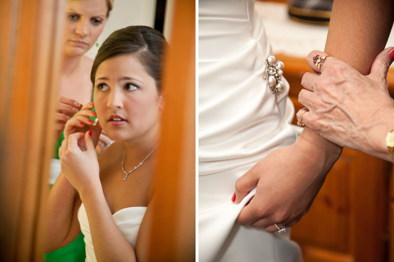 bride getting ready with detail of white dress and pearl brooch