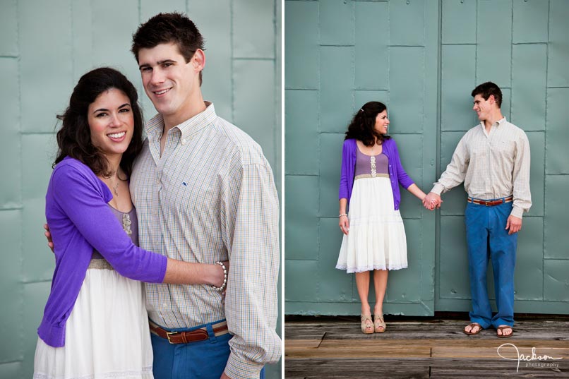 Couple posing in front of metal door in Fells Point