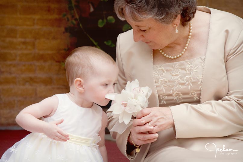 Flower girl smelling flowers