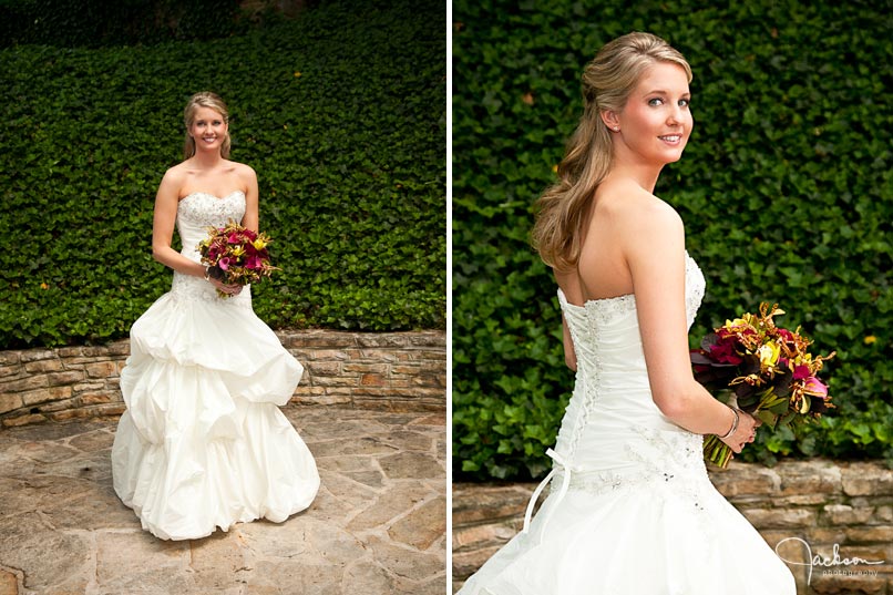 bride posing by green ivy