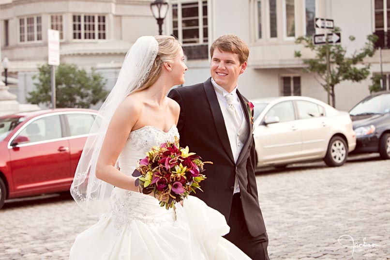bride and groom walking through mount vernon square
