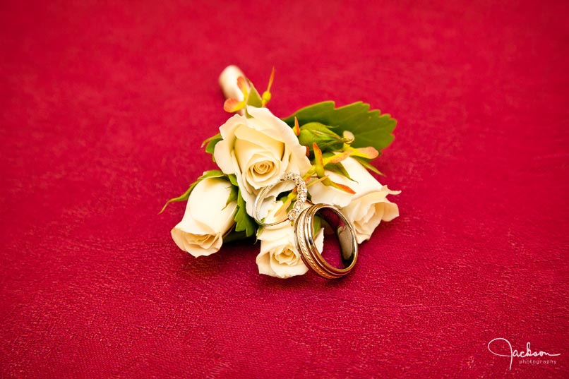 rings and flowers on red