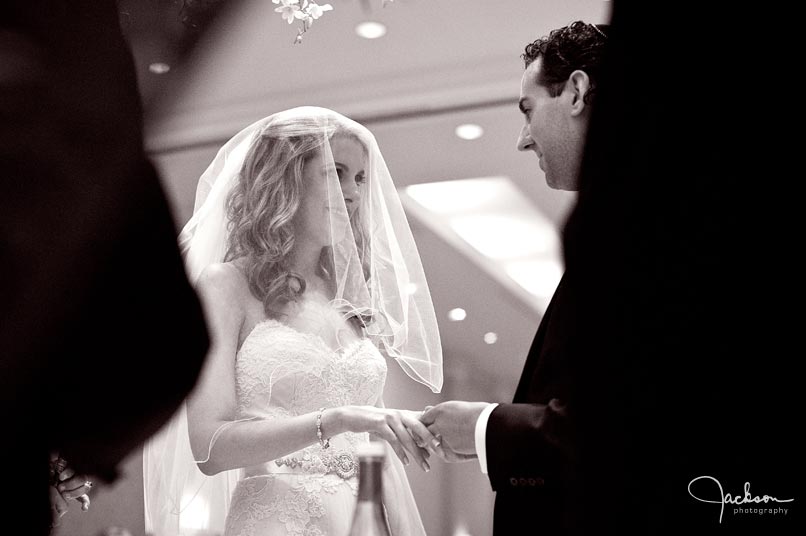 bride and groom exchanging rings