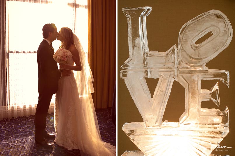 bride and groom kissing by window