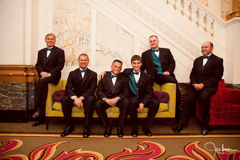 groomsmen on antique sofa