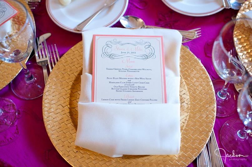 place setting and menu in gold and fuchsia 