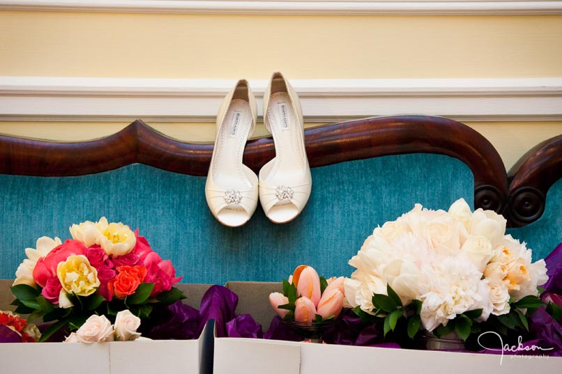 brides shoes flowers on blue couch