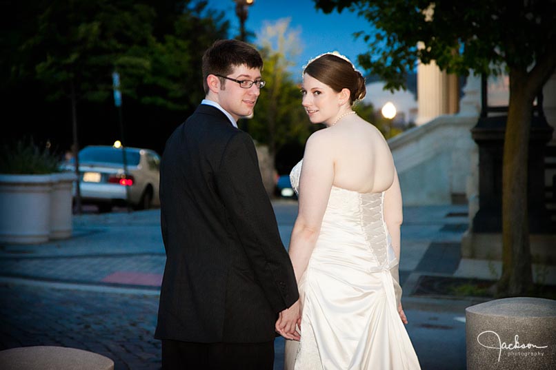 bride and groom walking at night