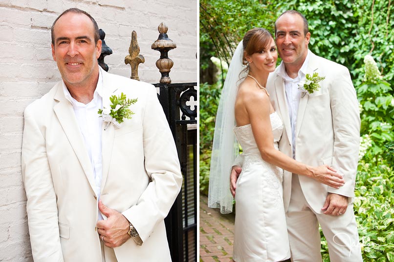 bride and groom posing in front of garden