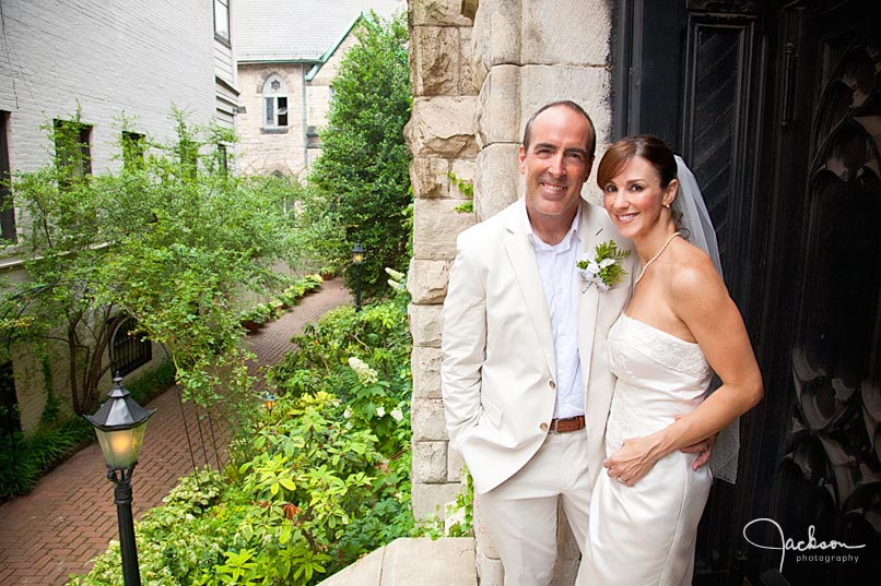 bride and groom on church stairwell