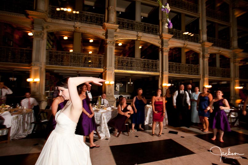 bride tossing bouquet