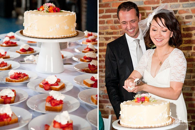 bride and groom cutting cake with strawberries