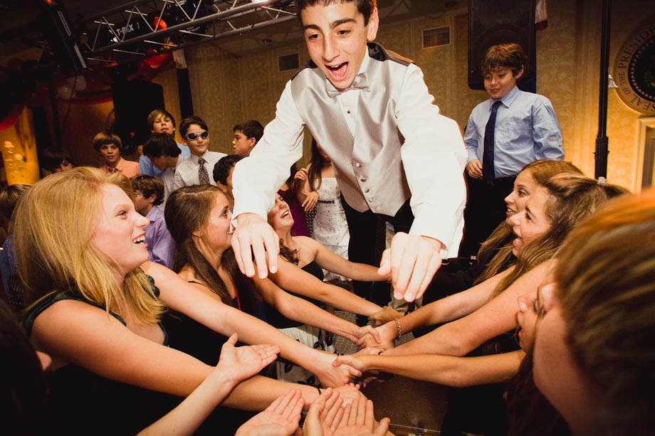 mitzvah boy diving into arms of friends