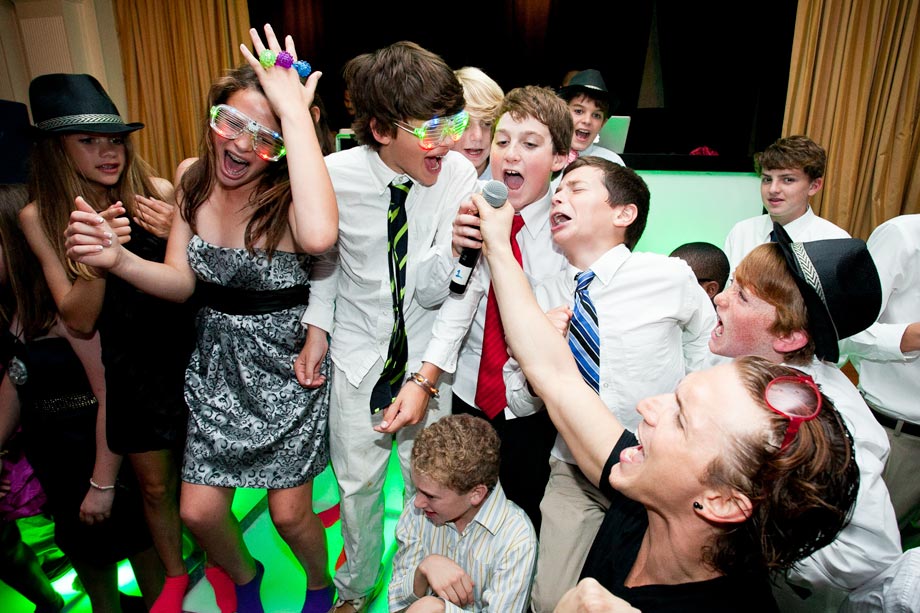 mitzvah boy singing with friends