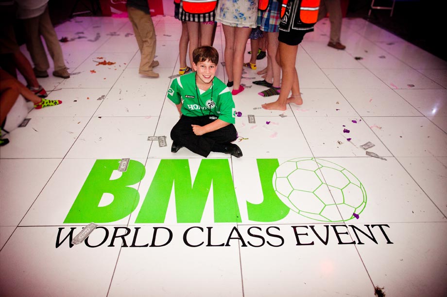 boy siting on green floor name decal