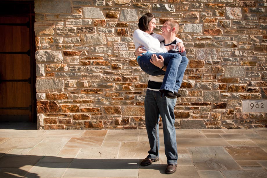 man carrying woman in his arms