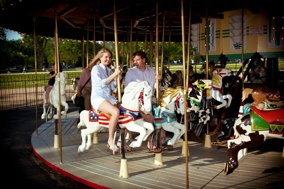 couple rideing merry go round