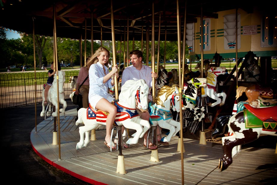 couple rideing merry go round