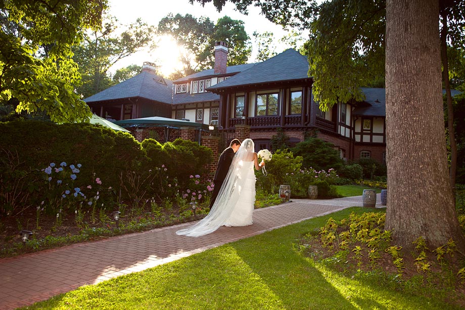 bride and groom walking down gramercy path