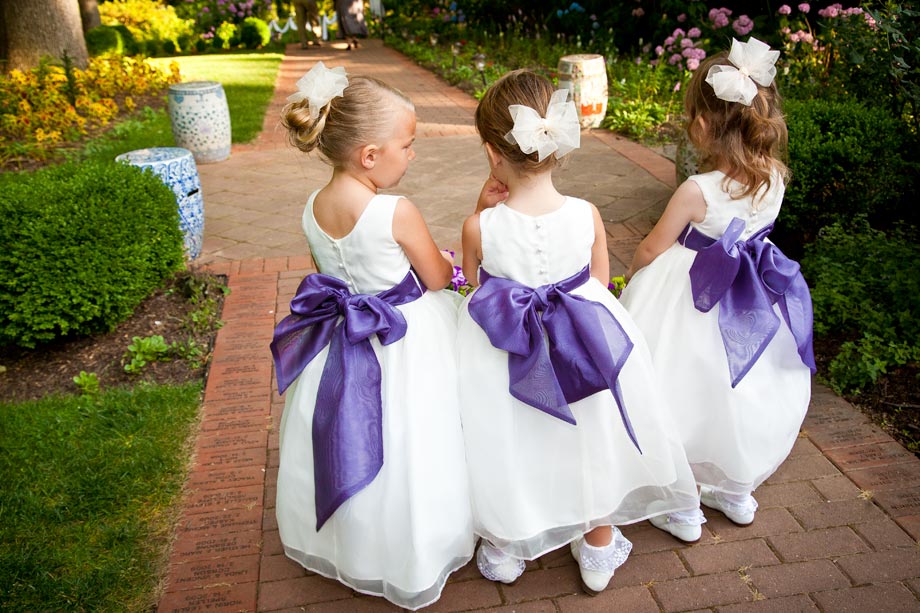 flower girls with purple sashes