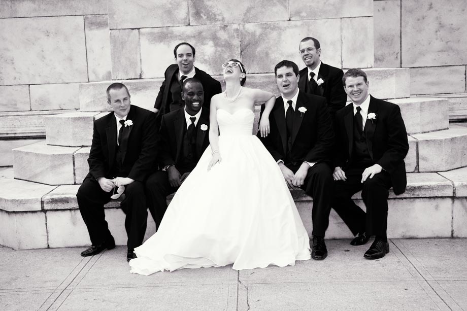 bride laughing with groomsmen