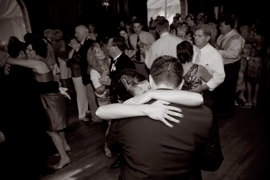 bride hugging groom while dancing