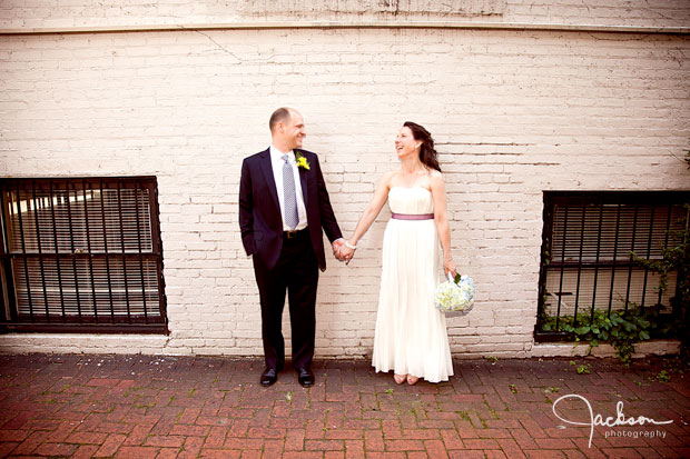 bride and groom holding hands