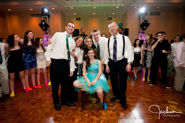 mitzvah family posing at party