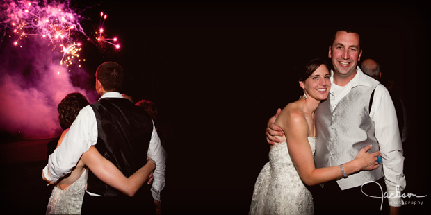 bride and groom looking a photographs