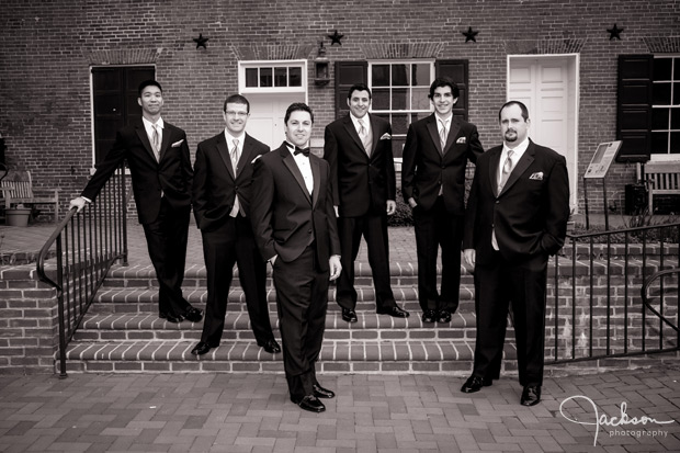 groom and groomsmen on brick steps