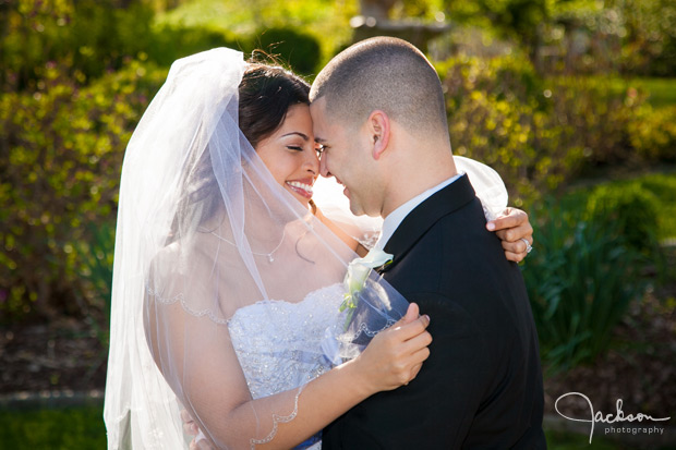 bride close to groom backlit by sun