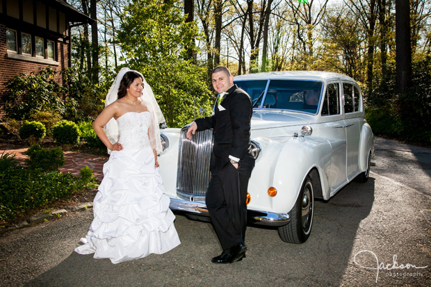 bride and groom in front of rolls royce