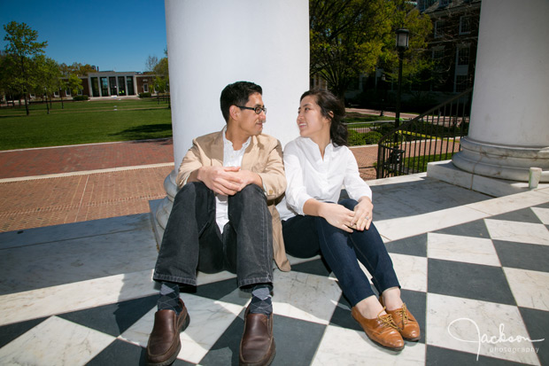 couple sitting by column