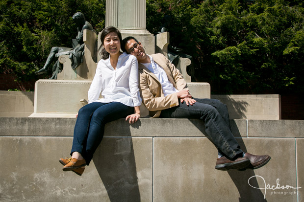 couple sitting in front of sculpture