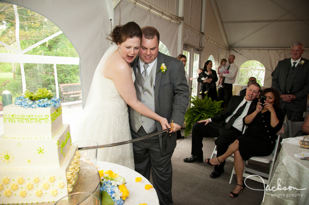 cutting the cake with a sword