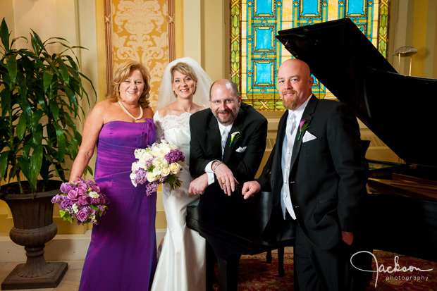 bridal party by piano