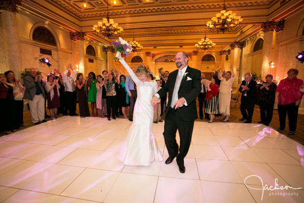 bride and groom entering the reception