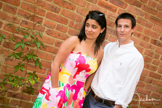 couple in front of brick wall