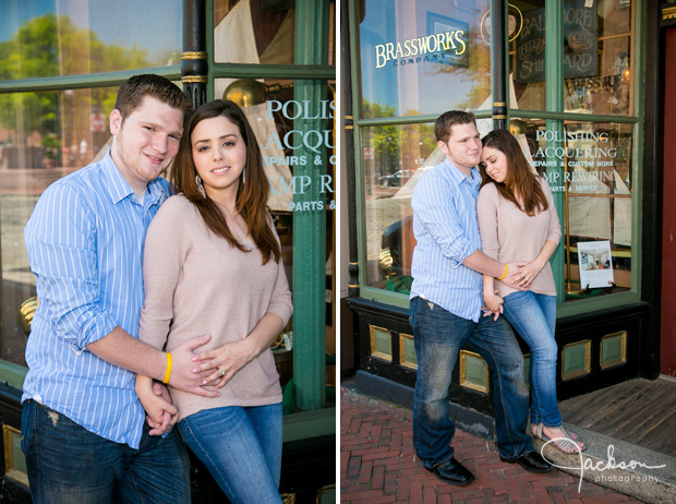 couple posing at reflective storefront window