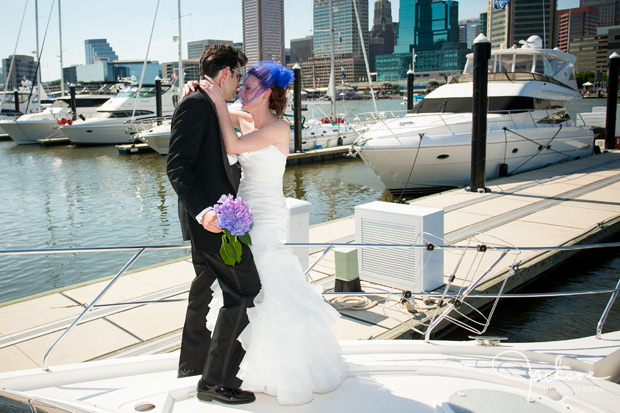 bride and groom embracing on boat