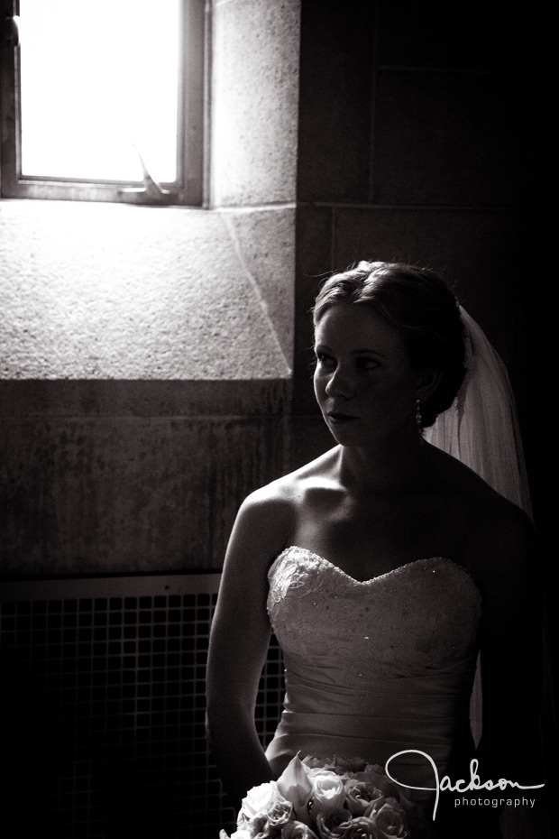 bride lit by window of loyola chapel