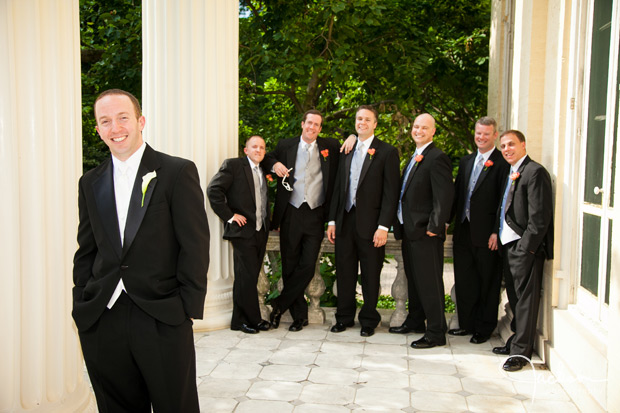 groom and groomsmen on the steps of evergreen