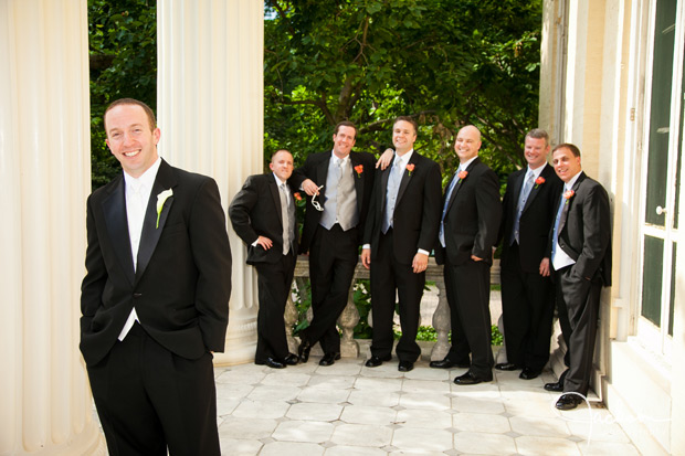 groom and groomsmen on the steps of evergreen