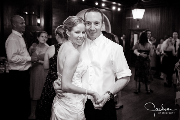 bride and groom dancing in carriage house