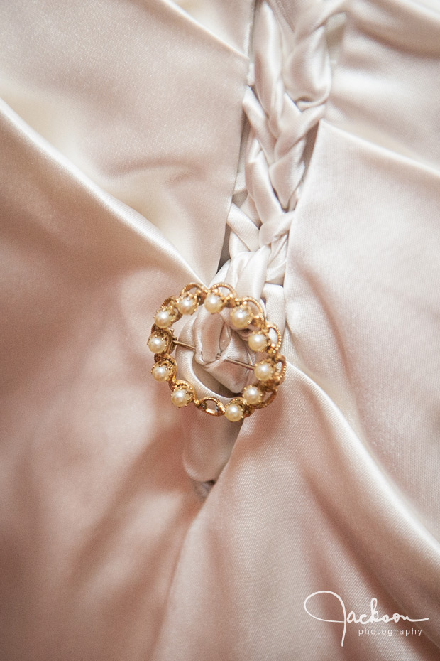 brooch on brides dress