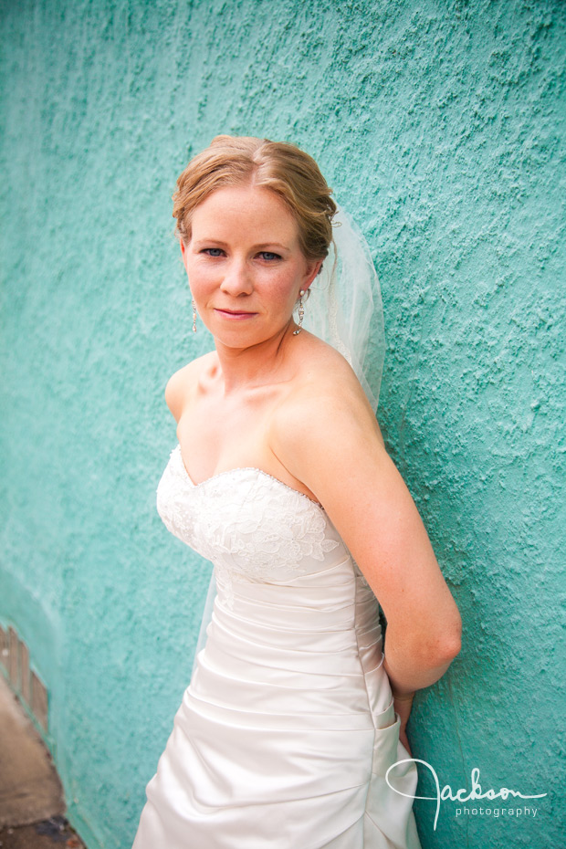 bride on blue stucco wall