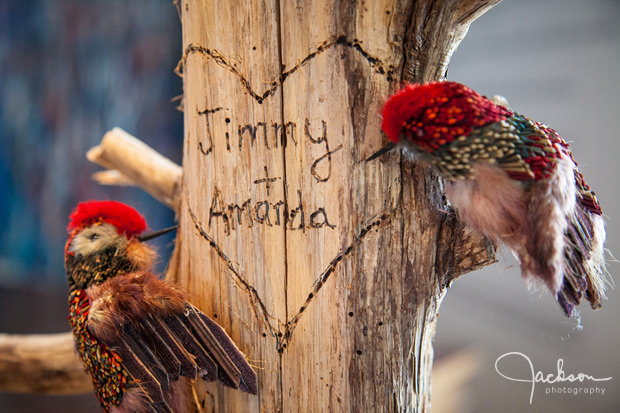 names carved on wood with birds