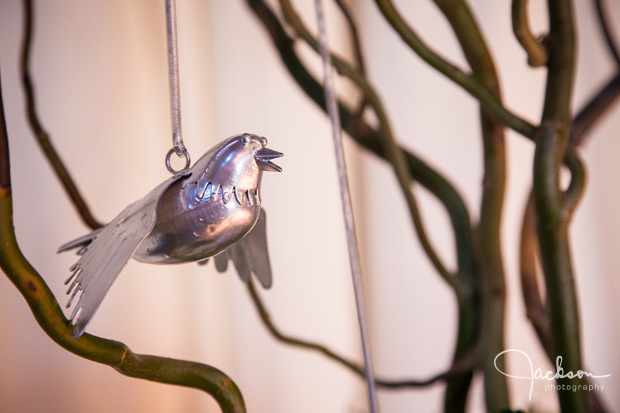 metal bird hanging from ceremony tree